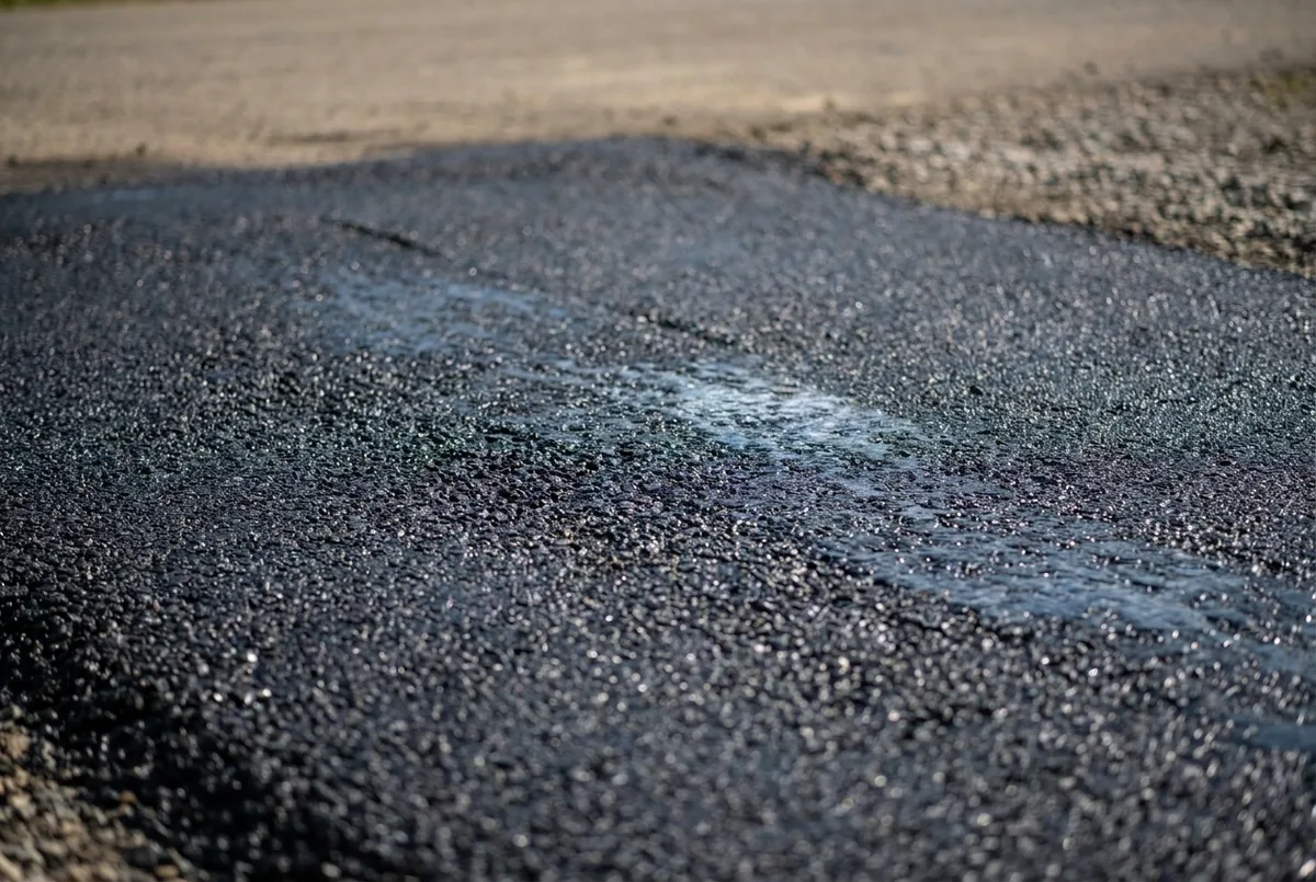 Macro close up of freshly rolled asphalt aggregate