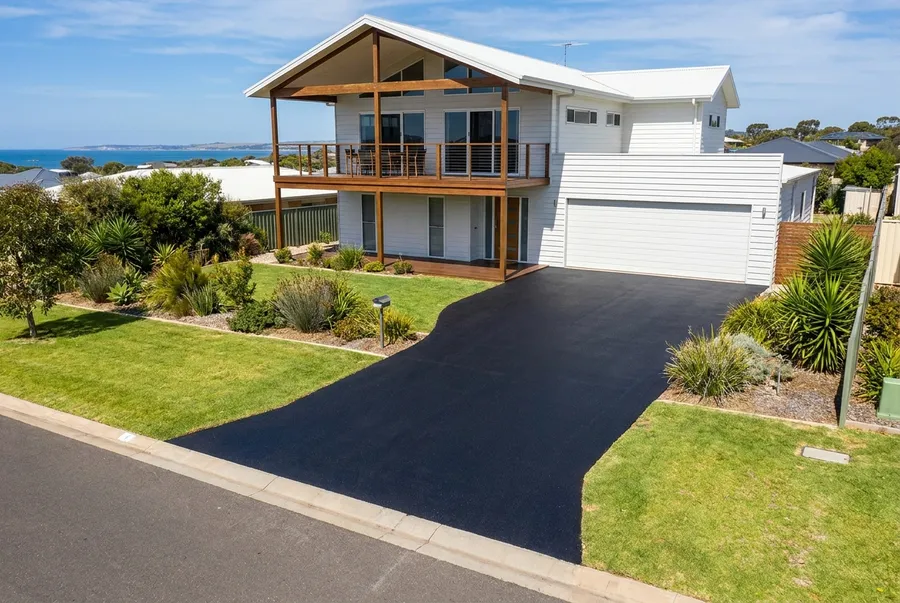New asphalt driveway at a modern two storey coastal home