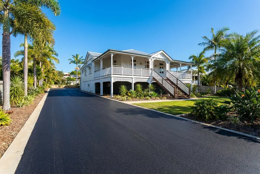 New asphalt driveway at a white Queenslander home